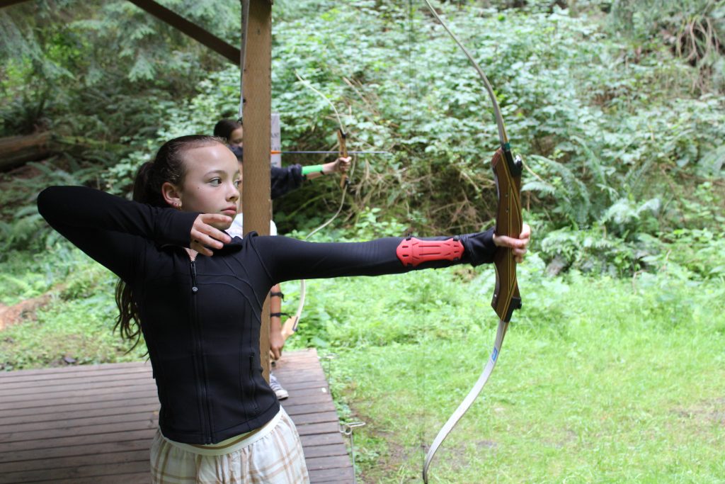a girl shooting an arrow