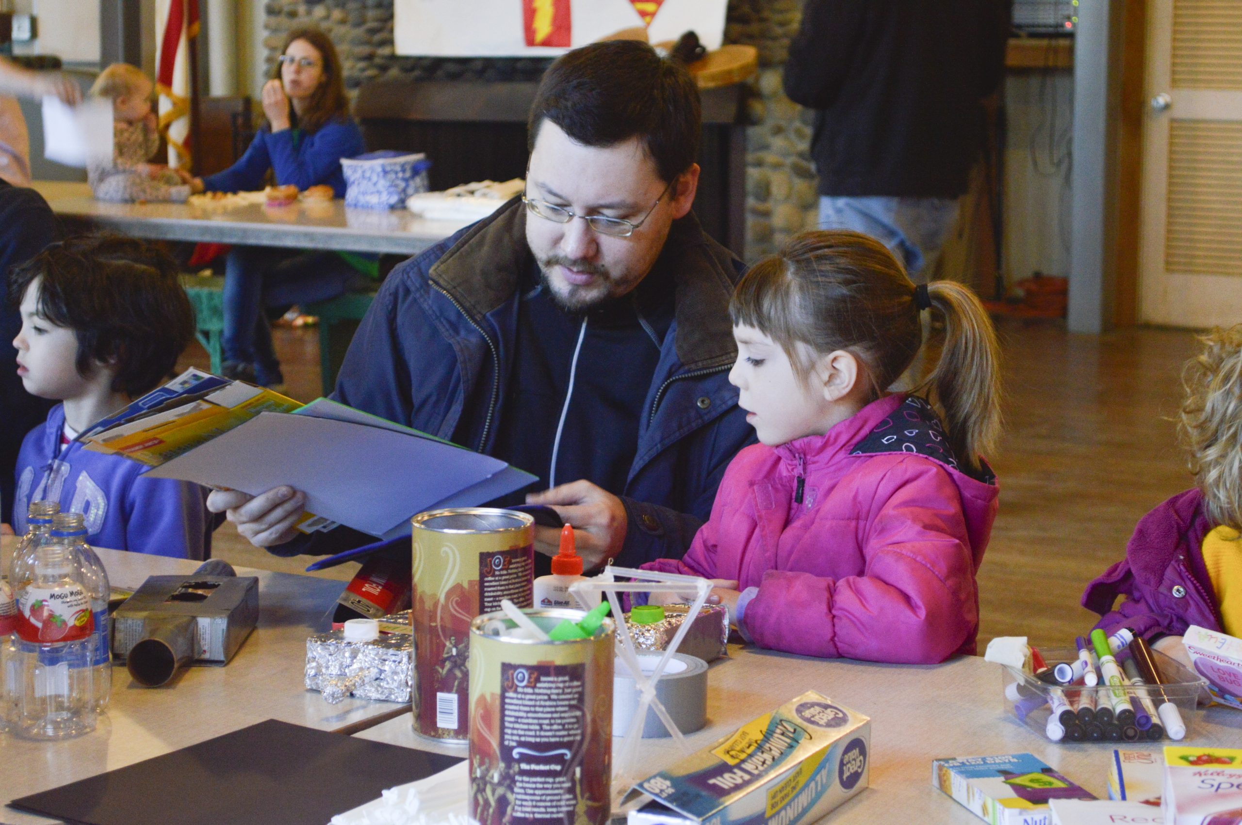 Dad and kid working on project