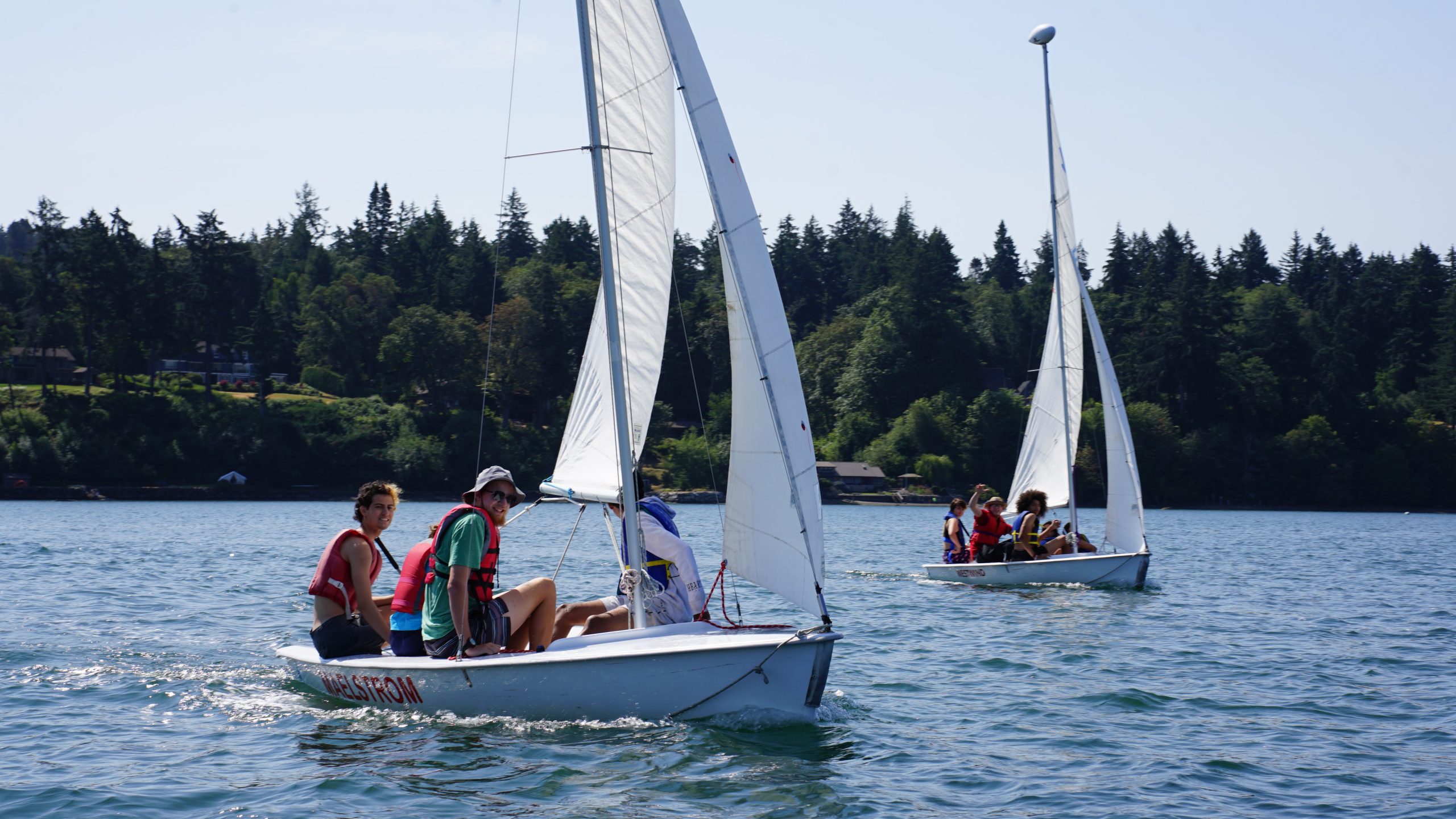 campers and staff in sail boat