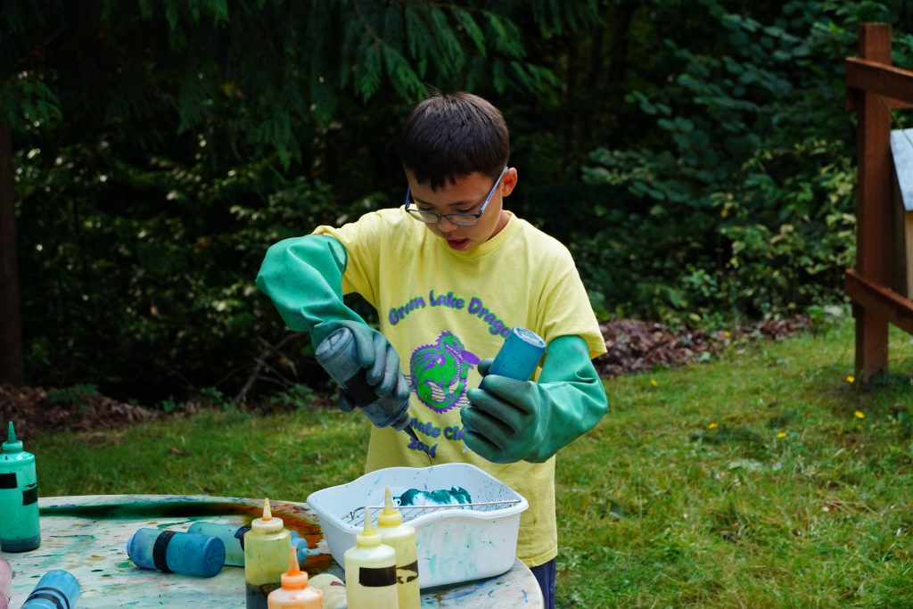 camper doing tie dye