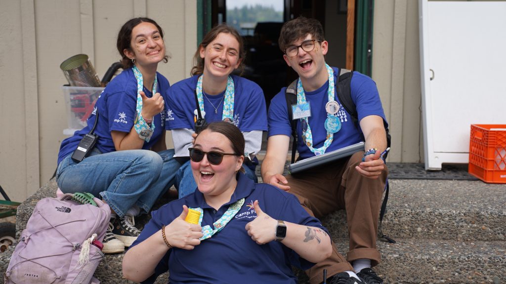 smiling camp sealth staff in their uniforms