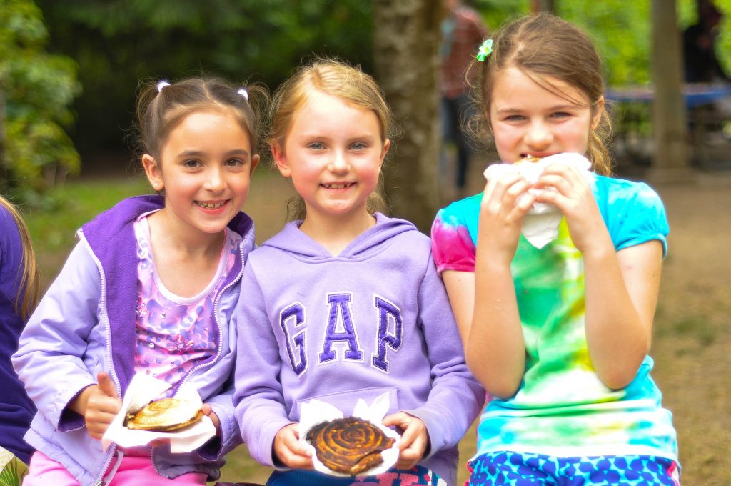 Some campers enjoying the food that they made during the outdoor cooking lesson!