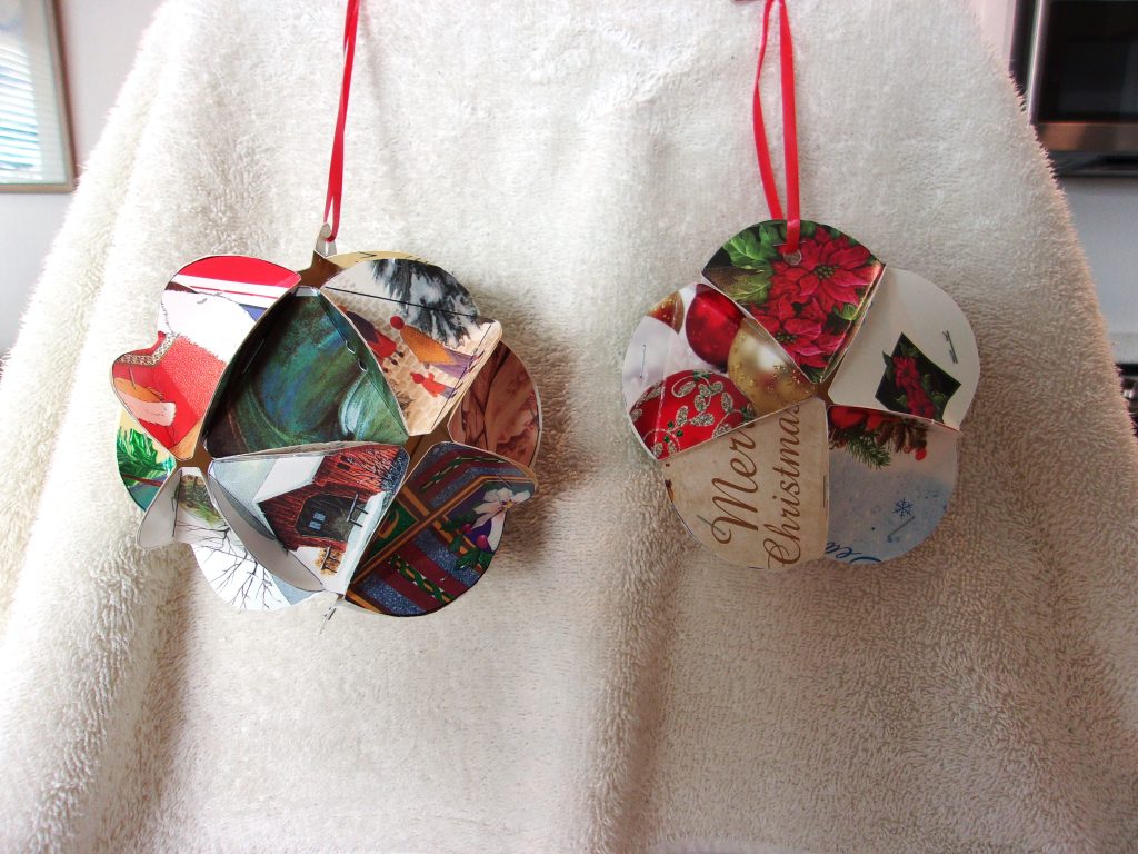 2 holiday ornaments constructed from holiday cards.