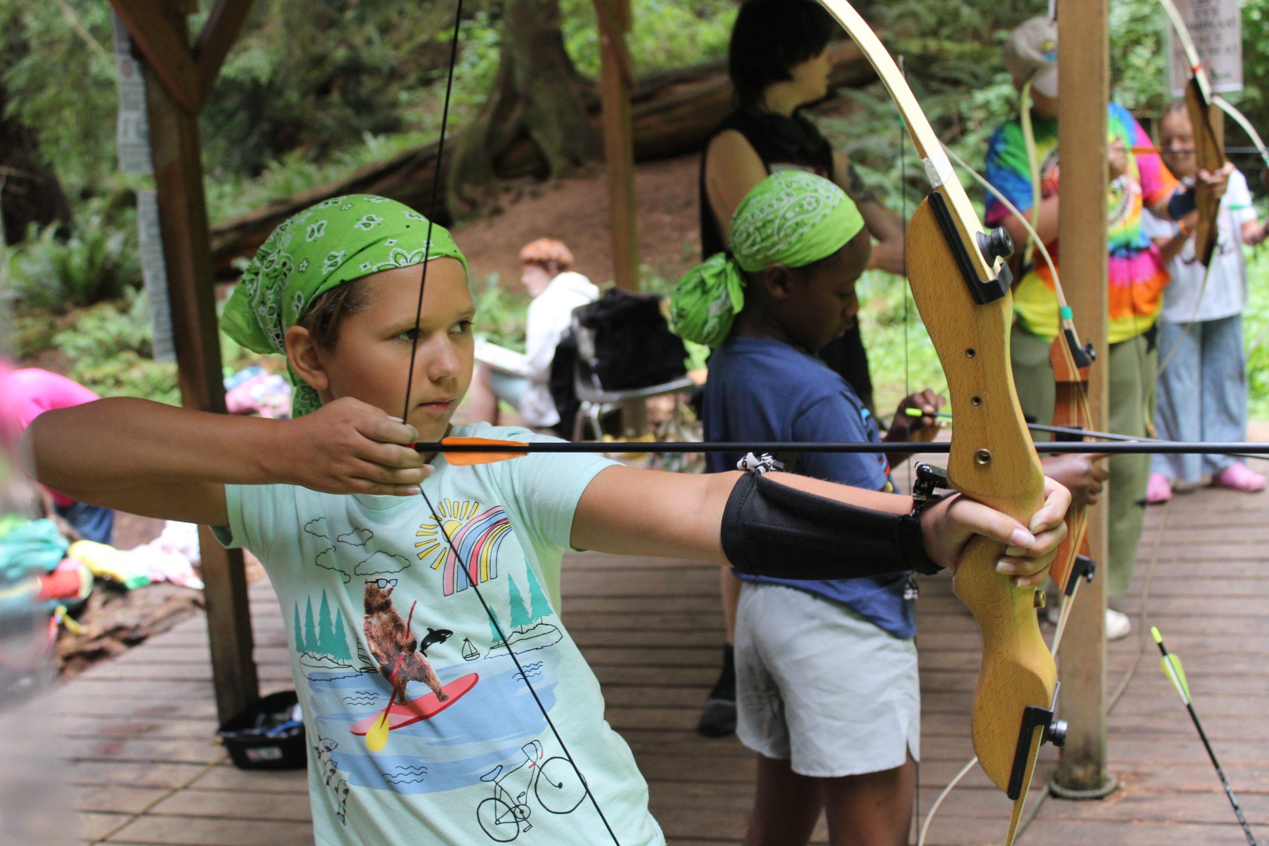 campers on the archery range lining up to get the perfect shot