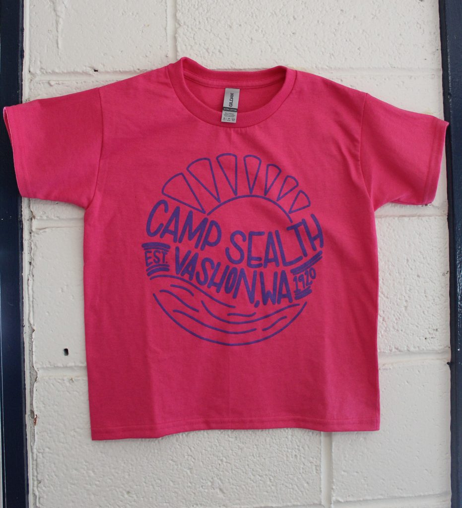 A pink t-shirt with Camp Sealth logo