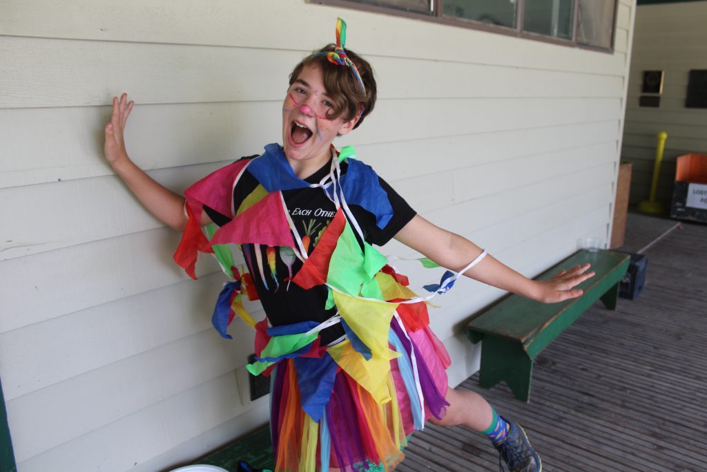 camper in a costume smiling