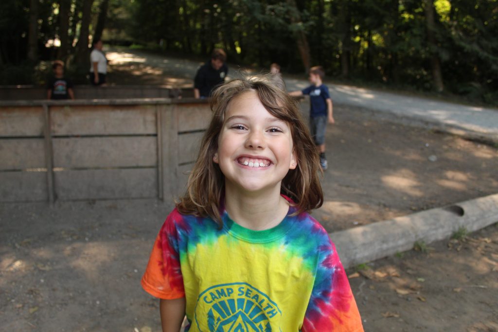 smiling camper with tie dye shirt