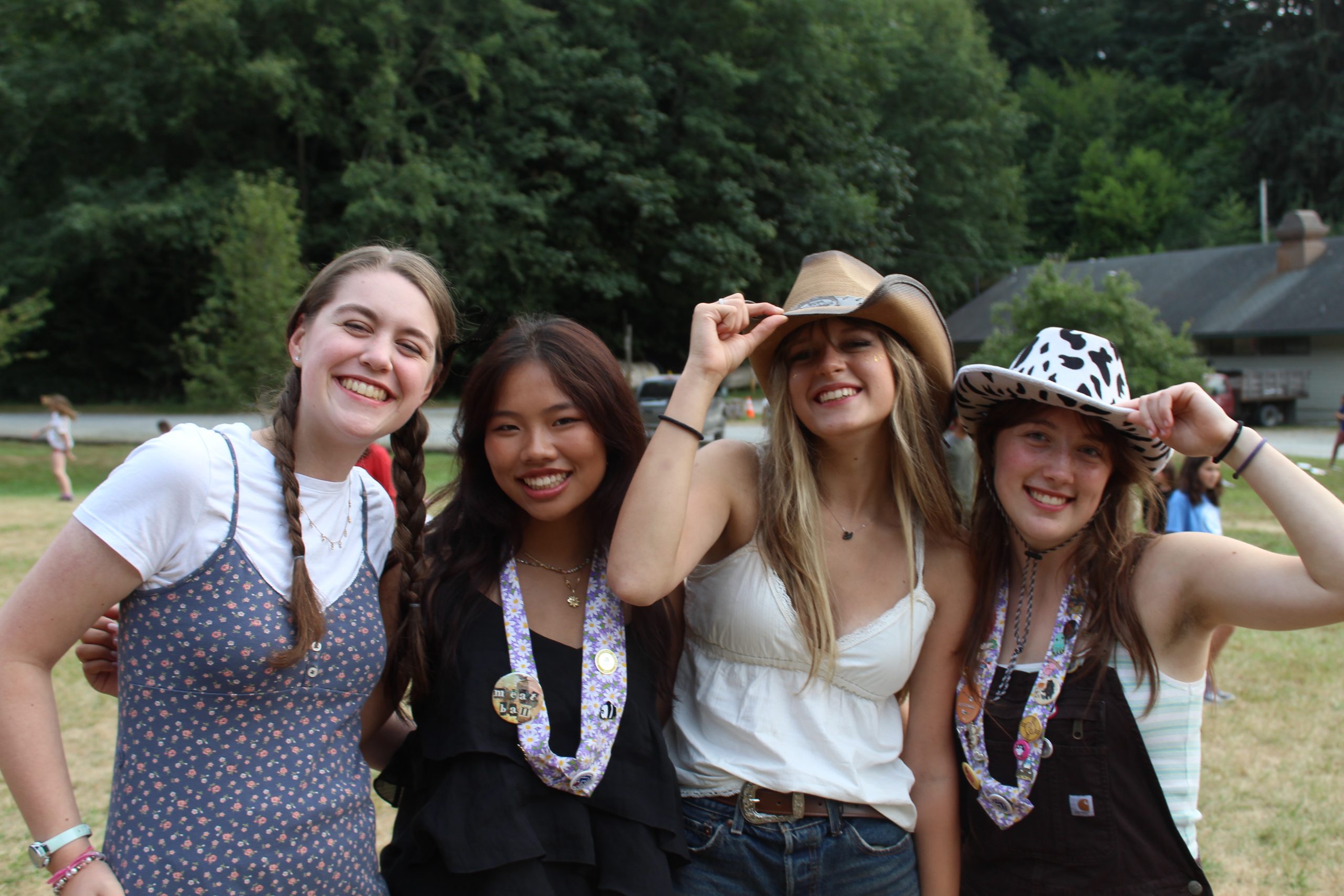 leads in cowboy hats flashing smiles