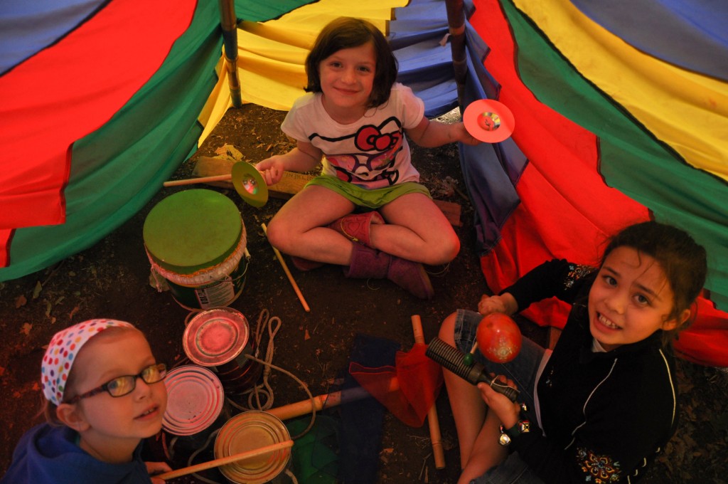 Campers in tent at Woodland Park